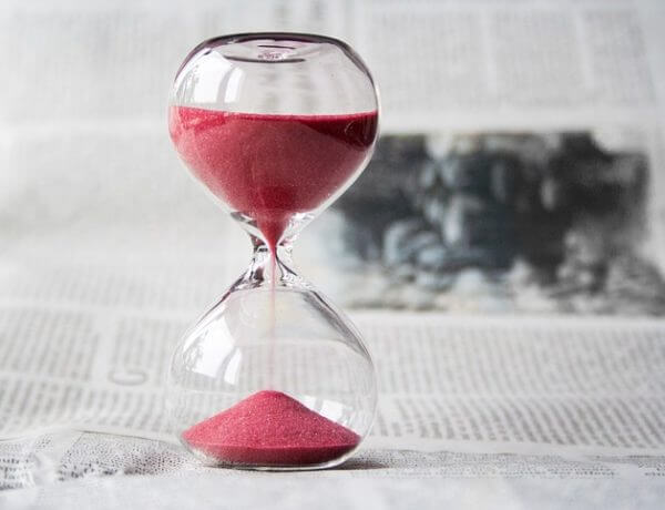 Sinking sand in hourglass. Skepticism that we are in the last days.